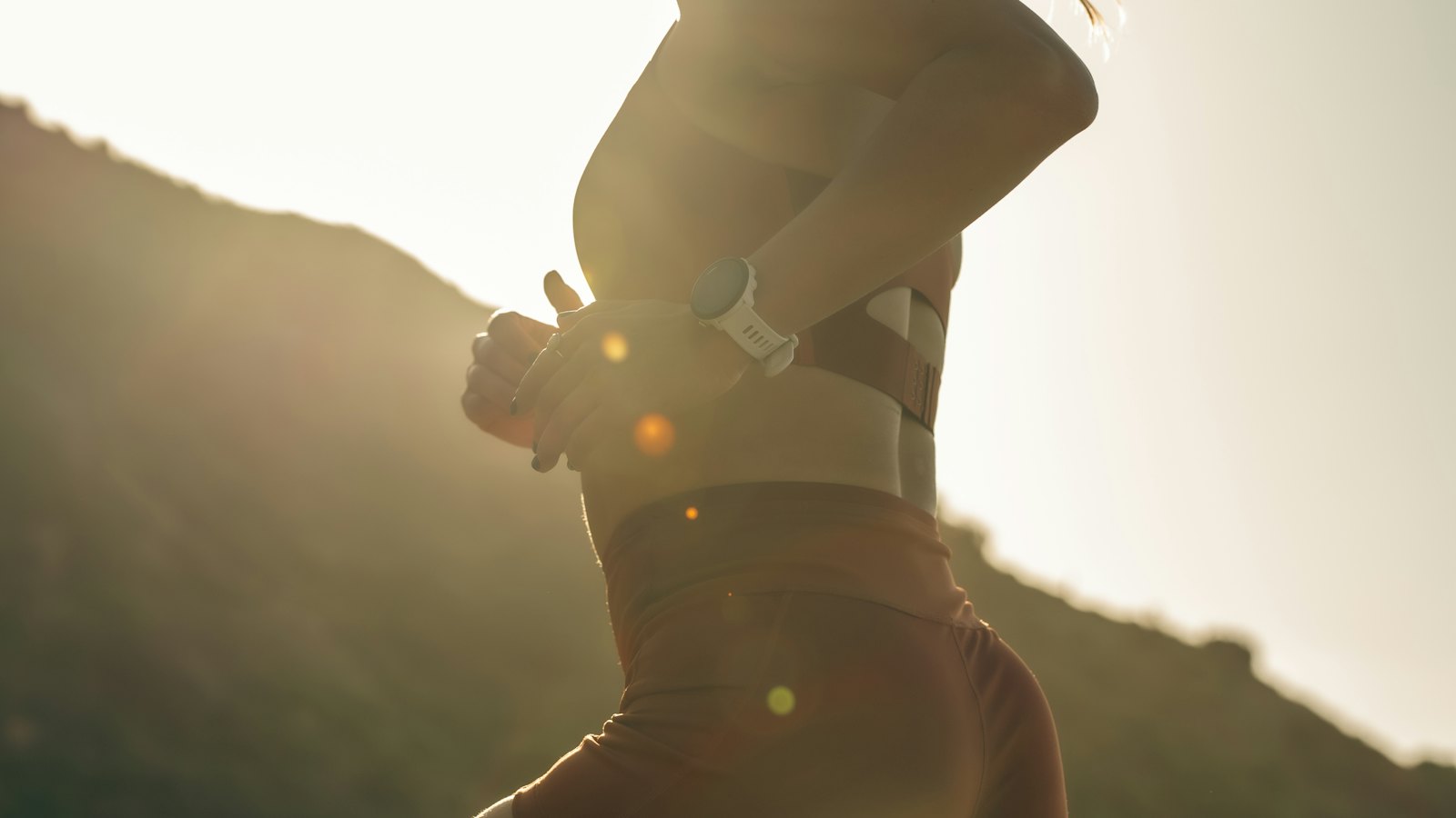 Person running outdoors at golden hour